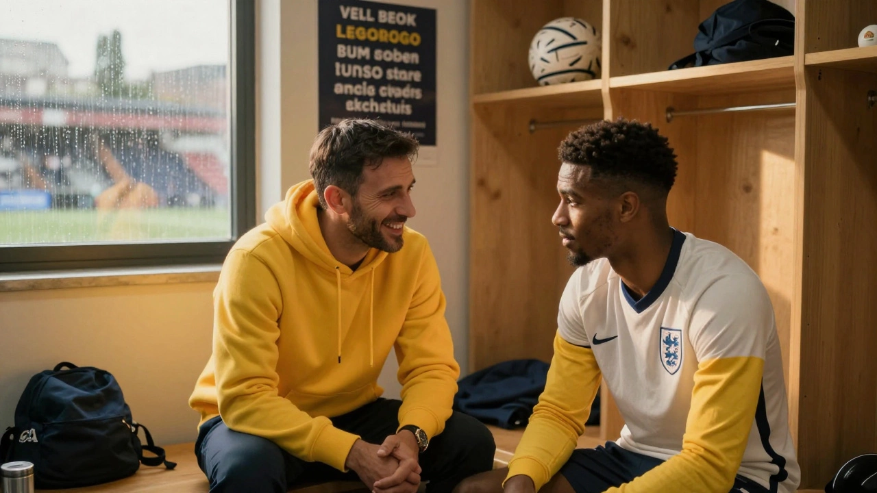 An American coach smiles at a player in a locker room, rain on the windows behind them.