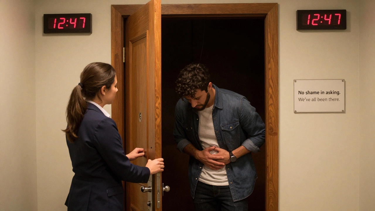 A staff member unlocks the door as a player exits an escape room with visible relief.