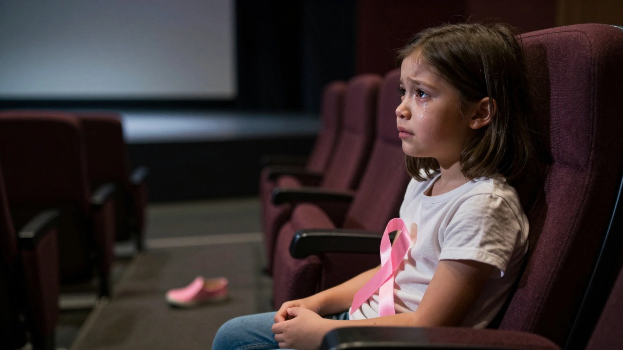 A child sits crying in a dark theater, a single shoe on the floor, faint light from the stage behind.