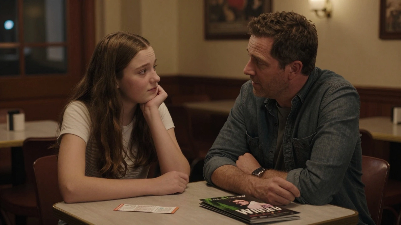 Parent and teenager having a meaningful conversation after watching a play